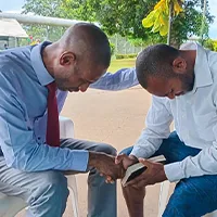 Two men praying together